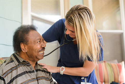 Home health nurse providing care